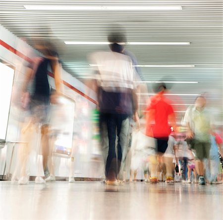 Crowd of people in corridor in subway, blurred motion Stock Photo - Budget Royalty-Free & Subscription, Code: 400-04258130