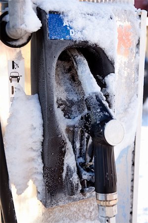 pumped up - A gas pump frozen with ice and snow - frozen gas prices concept Stock Photo - Budget Royalty-Free & Subscription, Code: 400-04258461