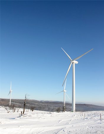 Single wind turbine generating electricity in winter landscape Stock Photo - Budget Royalty-Free & Subscription, Code: 400-04259328