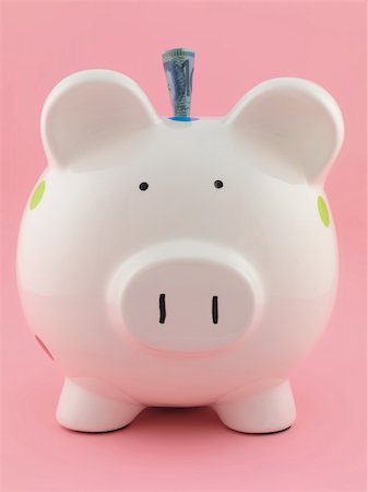 simsearch:400-06077471,k - A piggy bank isolated against a pink background Stock Photo - Budget Royalty-Free & Subscription, Code: 400-04259426
