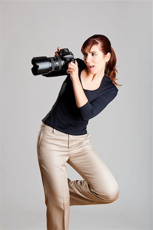 people taking pictures of models - Portrait of a beautiful and attractive young woman holding a camera Stock Photo - Budget Royalty-Free & Subscription, Code: 400-04265769