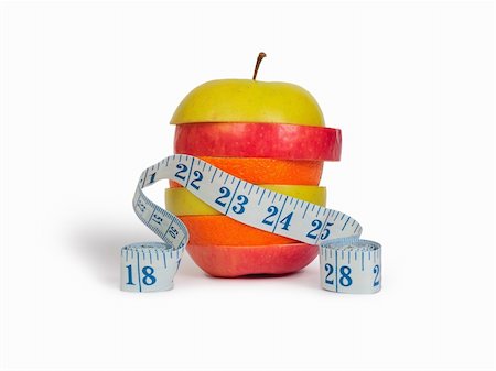 simsearch:400-05367726,k - Slices of apples and orange as one fruit and a measuring tape. Isolated with clipping path. Stock Photo - Budget Royalty-Free & Subscription, Code: 400-04267787