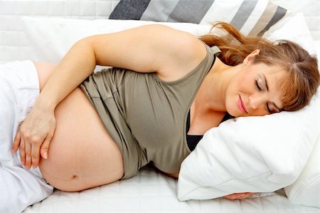 simsearch:400-04875116,k - Beautiful pregnant woman sleeping  on sofa at home Stock Photo - Budget Royalty-Free & Subscription, Code: 400-04268431