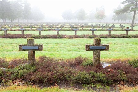 simsearch:400-04032243,k - crosses at cemetery in autumn mist stone tombstones Stock Photo - Budget Royalty-Free & Subscription, Code: 400-04260895
