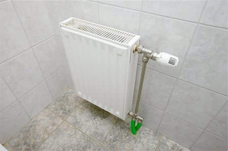 Heating radiator in a bathroom Stock Photo - Budget Royalty-Free & Subscription, Code: 400-04274513