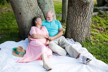 simsearch:400-04208630,k - Romantic senior couple relaxes outdoors in the park. Stock Photo - Budget Royalty-Free & Subscription, Code: 400-04275708