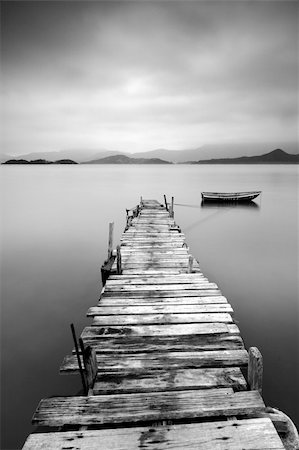simsearch:400-04756224,k - Looking over a desolate peer and a boat, black and white Stock Photo - Budget Royalty-Free & Subscription, Code: 400-04276047