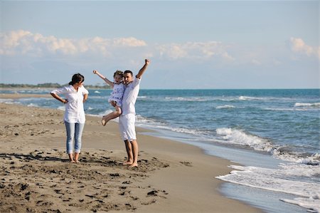 simsearch:400-05309800,k - happy young family in white clothing have fun and playing at vacations on beautiful beach Stock Photo - Budget Royalty-Free & Subscription, Code: 400-04271150