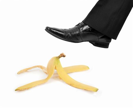 slapstick - Business risk concept: boot to step on a banana skin Stock Photo - Budget Royalty-Free & Subscription, Code: 400-04271954