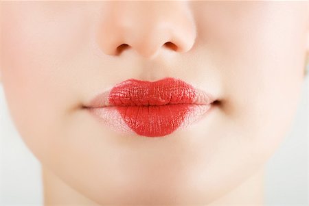 simsearch:400-04932642,k - heart on lips of pretty woman closeup Photographie de stock - Aubaine LD & Abonnement, Code: 400-04271992