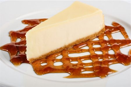 simsearch:400-05173009,k - Cheese Cake with honey sauce closeup on white plate Stock Photo - Budget Royalty-Free & Subscription, Code: 400-04284619