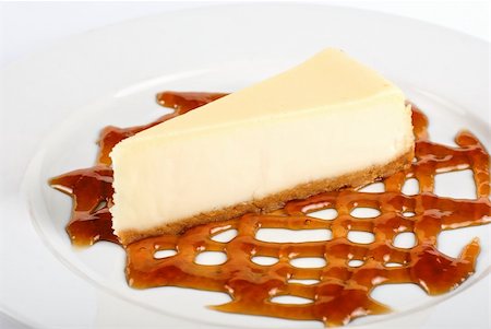 simsearch:400-05173009,k - Cheese Cake with honey sauce closeup on white plate Stock Photo - Budget Royalty-Free & Subscription, Code: 400-04284620