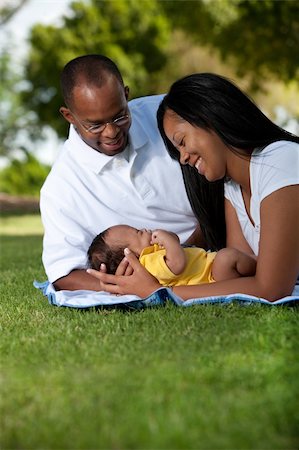 Loving couple with newborn at the park Stock Photo - Budget Royalty-Free & Subscription, Code: 400-04284919