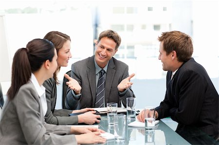 simsearch:400-05746962,k - Delighted managertalking to his team at a table during a meeting Stock Photo - Budget Royalty-Free & Subscription, Code: 400-04287066