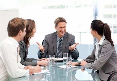 simsearch:400-05746962,k - Cheeful manager talking to his team at a meeting in the office Stock Photo - Budget Royalty-Free & Subscription, Code: 400-04287068