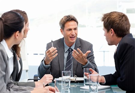 simsearch:400-05746962,k - Charismatic chairman talking with his team during a meeting Stock Photo - Budget Royalty-Free & Subscription, Code: 400-04287063