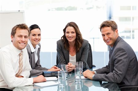simsearch:400-05746962,k - Portrait of a businesswoman with her team sitting at a table Stock Photo - Budget Royalty-Free & Subscription, Code: 400-04287071