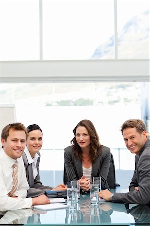 simsearch:400-05746962,k - Confident businesswoman with her team at a table during a meeting Stock Photo - Budget Royalty-Free & Subscription, Code: 400-04287072