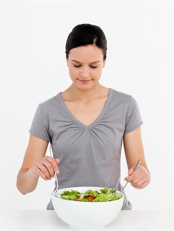 simsearch:400-05744780,k - Lovely woman mixing a salad standing in the kitchen at home Stock Photo - Budget Royalty-Free & Subscription, Code: 400-04287241