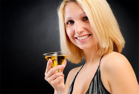 simsearch:400-08348807,k - Sexy smiling blonde standing with goblet Stock Photo - Budget Royalty-Free & Subscription, Code: 400-04288386