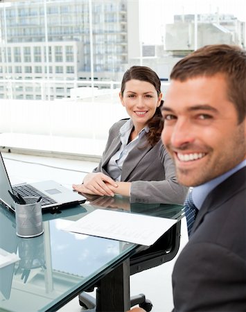 Two positive business people smiling at the camera during an interview Stock Photo - Budget Royalty-Free & Subscription, Code: 400-04281546