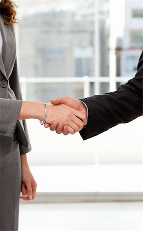 simsearch:400-04333648,k - Close up of a businessman and businesswoman shaking their hands after a meeting Stock Photo - Budget Royalty-Free & Subscription, Code: 400-04281547