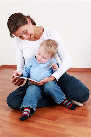 Smart little boy reading with mom or kindergarten teacher Stock Photo - Budget Royalty-Free & Subscription, Code: 400-04283345