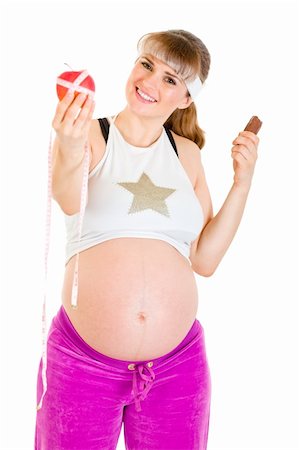 simsearch:400-04798379,k - Apple or chocolate? Pregnant woman choosing  healthy lifestyle isolated on white. Stock Photo - Budget Royalty-Free & Subscription, Code: 400-04294344