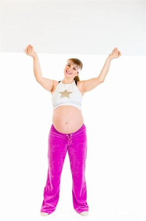 simsearch:400-04798379,k - Smiling beautiful pregnant woman holding blank billboard over her head isolated on white Stock Photo - Budget Royalty-Free & Subscription, Code: 400-04294347