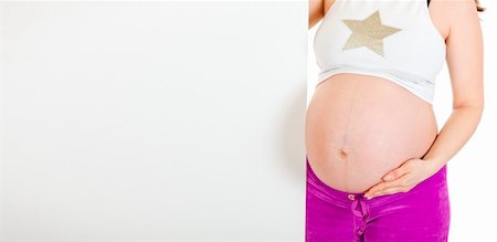 simsearch:400-04798379,k - Pregnant woman holding blank billboard  isolated on white. Close-up. Stock Photo - Budget Royalty-Free & Subscription, Code: 400-04294351