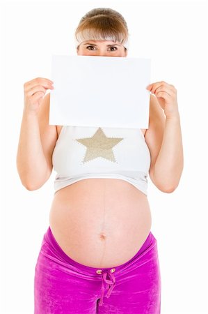 simsearch:400-04798379,k - Pregnant woman holding empty white  paper in front of her face isolated on white. Stock Photo - Budget Royalty-Free & Subscription, Code: 400-04294352