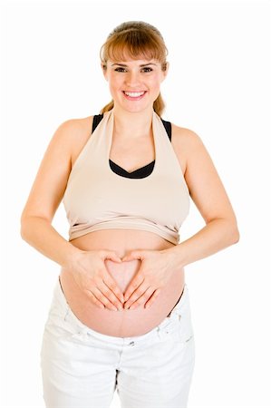 simsearch:400-04817039,k - Smiling pregnant woman making heart with her hands on tummy isolated on white Stock Photo - Budget Royalty-Free & Subscription, Code: 400-04294364