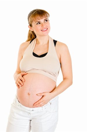 simsearch:400-04817039,k - Dreaming beautiful pregnant woman touching her belly isolated on white background Stock Photo - Budget Royalty-Free & Subscription, Code: 400-04294360