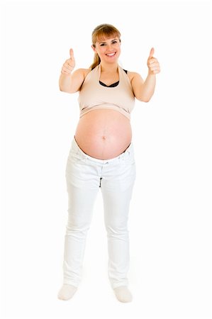 simsearch:400-04817039,k - Smiling pregnant woman showing  thumbs up gesture isolated on white Stock Photo - Budget Royalty-Free & Subscription, Code: 400-04294363