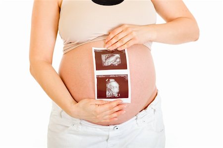 simsearch:400-04798379,k - Pregnant female holding echo in hands isolated on white. Close-up. Stock Photo - Budget Royalty-Free & Subscription, Code: 400-04294397