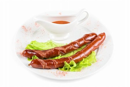 simsearch:400-04587885,k - grilled sausage closeup with lettuce and sauce isolated on white Stock Photo - Budget Royalty-Free & Subscription, Code: 400-04295184