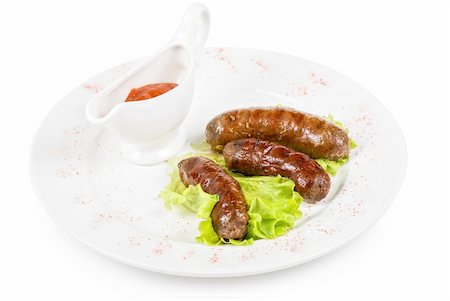 simsearch:400-04587885,k - grilled venison sausage on a white with lettuce and sauce Stock Photo - Budget Royalty-Free & Subscription, Code: 400-04295210