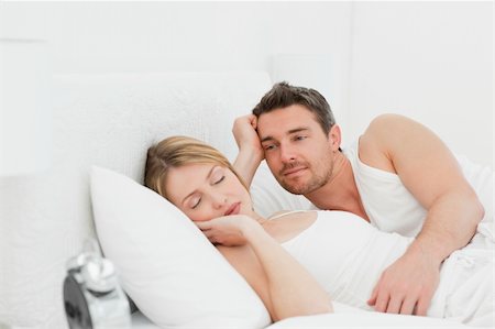 Boyfriend looking at his girlfriend who is  sleeping Stock Photo - Budget Royalty-Free & Subscription, Code: 400-04296921