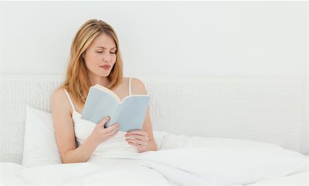 simsearch:400-04206778,k - Beautiful girl reading a book in her bed Foto de stock - Super Valor sin royalties y Suscripción, Código: 400-04297411