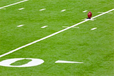 pigskin - Football on a kicking stand in the  football field Stock Photo - Budget Royalty-Free & Subscription, Code: 400-04290990