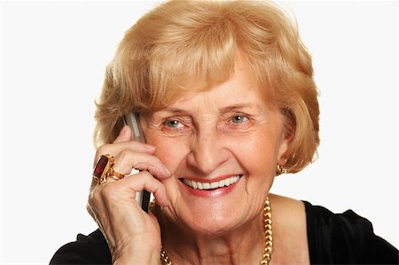 phone one person adult smile elderly - A portrait of a happy senior lady talking on the phone against white background Stock Photo - Budget Royalty-Free & Subscription, Code: 400-04292791