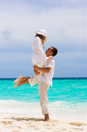 simsearch:628-00919176,k - Happy young couple on a tropical beach Stock Photo - Budget Royalty-Free & Subscription, Code: 400-04293004