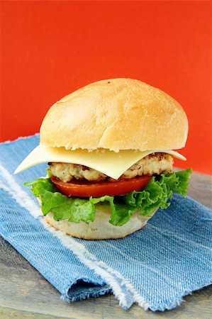simsearch:400-06090558,k - Cheeseburger with cheese and tomatoes on a stylish denim napkins Stock Photo - Budget Royalty-Free & Subscription, Code: 400-04304089
