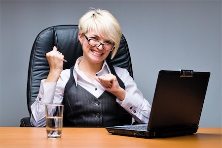 simsearch:400-05729275,k - Business woman working on her laptop in office Stock Photo - Budget Royalty-Free & Subscription, Code: 400-04308829