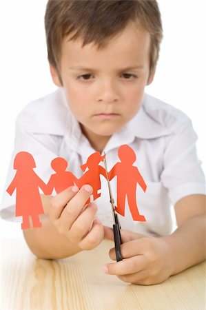 Sad boy cutting paper people family - divorce effect on kids concept, isolated closeup Stock Photo - Budget Royalty-Free & Subscription, Code: 400-04308860