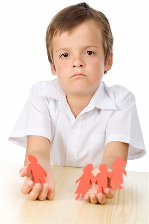 Divorce effect on kids concept with sad boy holding separated paper people family - isolated Stock Photo - Budget Royalty-Free & Subscription, Code: 400-04308861