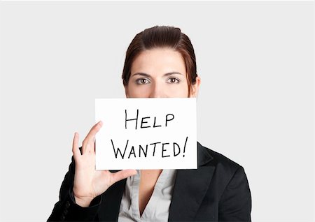 Business woman asking for help holding a cardboard with the text message "Help Wanted" Stock Photo - Budget Royalty-Free & Subscription, Code: 400-04309537