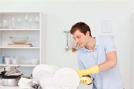 Man washing dishes  in the kitchen Stock Photo - Budget Royalty-Free & Subscription, Code: 400-04300851