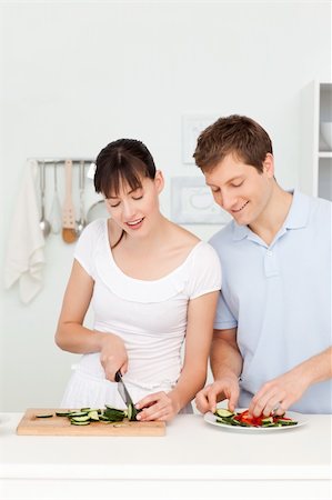 simsearch:400-05744780,k - Lovers cooking together in the kitchen at home Stock Photo - Budget Royalty-Free & Subscription, Code: 400-04300867