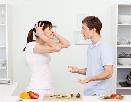 simsearch:400-05744780,k - Young lovers having dispute in the kitchen at home Stock Photo - Budget Royalty-Free & Subscription, Code: 400-04300870